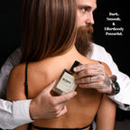 MYDOFT PERFUME IN THE HAND OF A MAN HUGGING A WOMEN