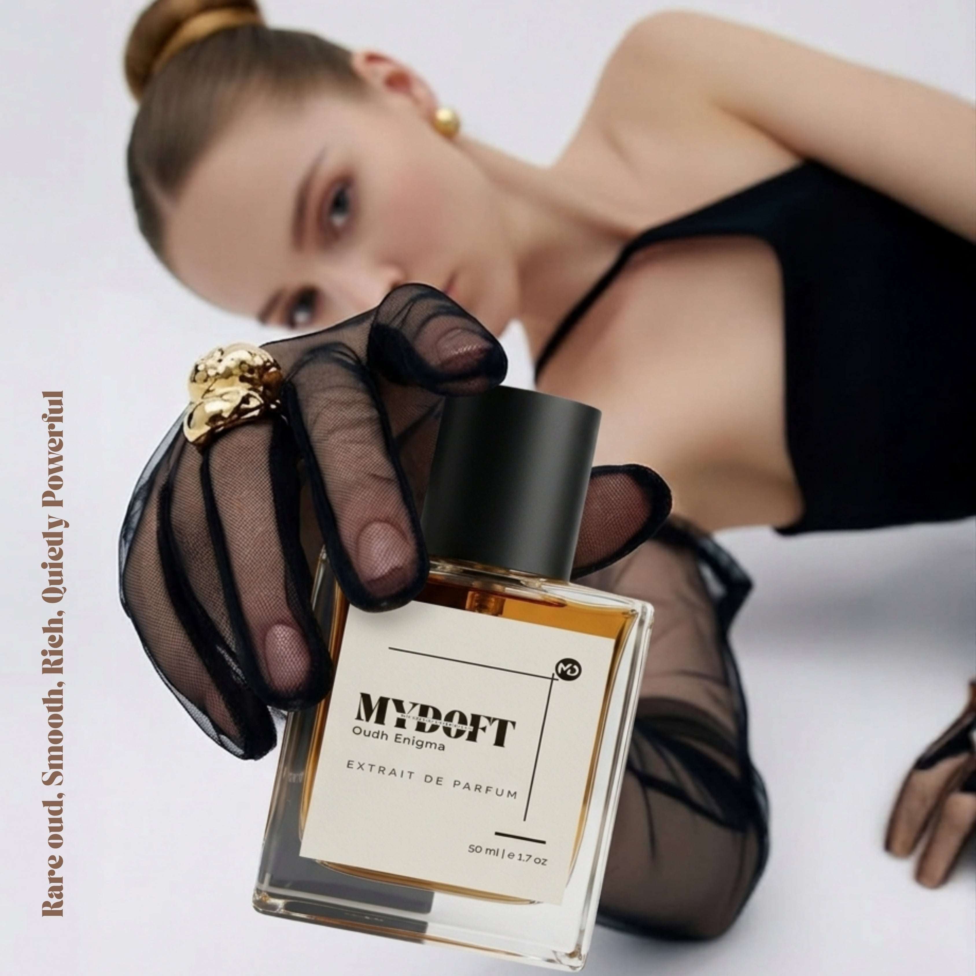 A FASION MODEL HOLDING MYDOFT PERFUME BOTTLE FOR A SHOOT